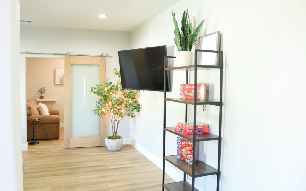 Common room with television and games at a New Start CLHF